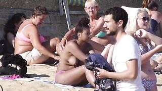 Brunette babe tanning topless her boobs and perky nipples