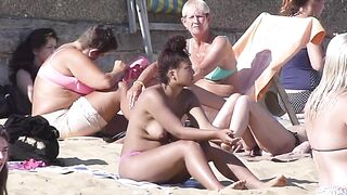 Brunette babe tanning topless her boobs and perky nipples