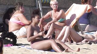 Brunette babe tanning topless her boobs and perky nipples