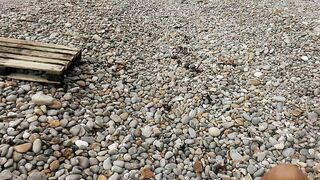 Kinky voyeur husband expose chubby wife tanning topless on rocky beach