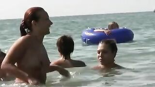 Watch these smooth nudists play at a public beach