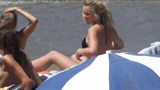 Beach Girls topless tanning