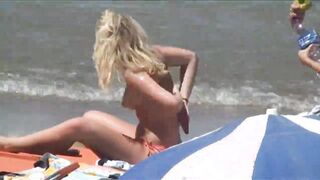 Beach Girls topless tanning