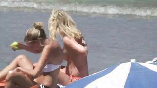 Beach Girls topless tanning