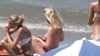 Beach Girls topless tanning