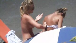 Beach Girls topless tanning