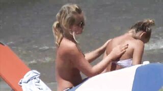 Beach Girls topless tanning