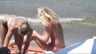 Beach Girls topless tanning