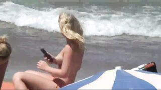 Beach Girls topless tanning