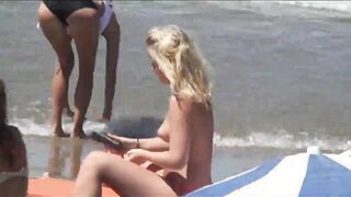 Beach Girls topless tanning