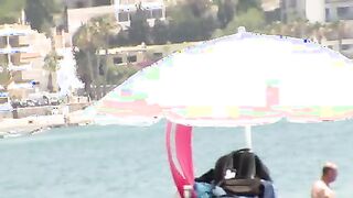 Nude beach topless girls tanning