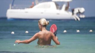 Frisky blonde babe expose her perky awesome tits on topless beach