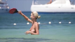 Frisky blonde babe expose her perky awesome tits on topless beach