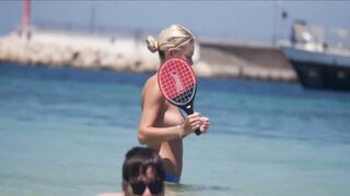 Frisky blonde babe expose her perky awesome tits on topless beach