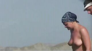 Totally naked teenager on spy beach