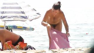 Nude beach wife exposing her hairy pussy