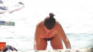 Nude beach wife exposing her hairy pussy