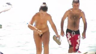 Nude beach wife exposing her hairy pussy