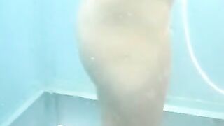 Nude girls caught by spy cam on beach shower cabin