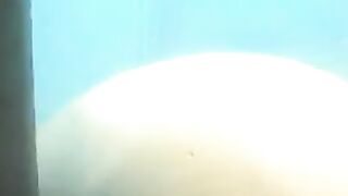 Nude girls caught by spy cam on beach shower cabin