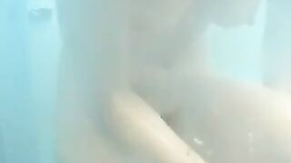 Nude girls caught by spy cam on beach shower cabin