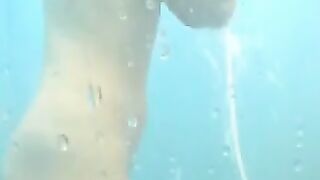 Nude girls caught by spy cam on beach shower cabin