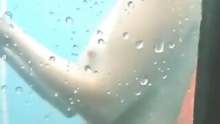 Nude girls caught by spy cam on beach shower cabin