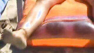 Beach spread on a nude beach of a Milf