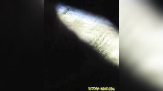 Beach nudist tanning legs spreading