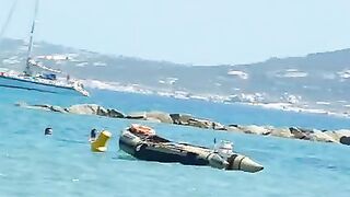 Beach voyeur 04 - Topless women puts sun cream on face