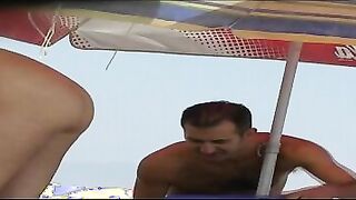 Nudist babe exposed tanning naked on voyeur beach