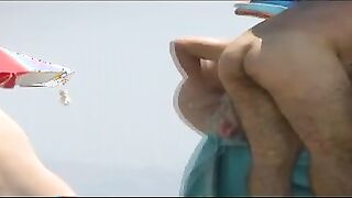 Nudist babe exposed tanning naked on voyeur beach